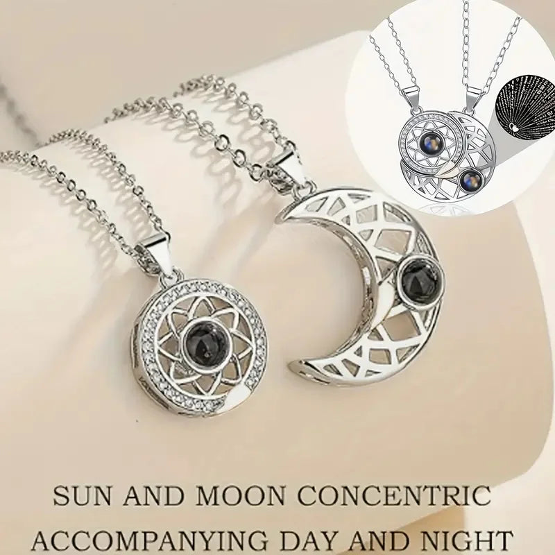 Silver necklace with moon and sun design on a beige background